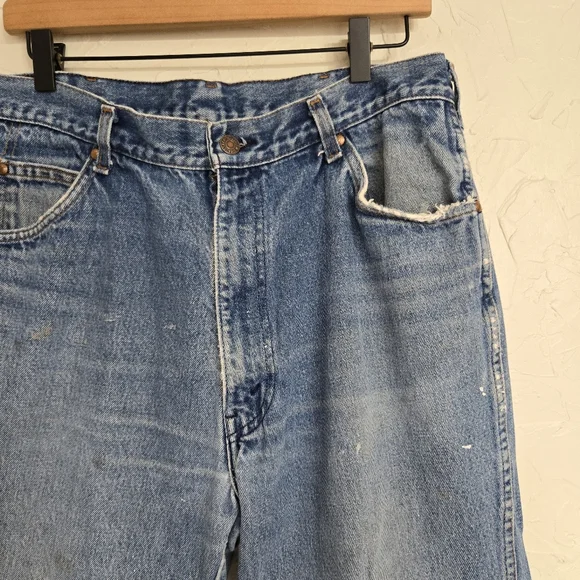 Vintage Levi's 557 Cowboy Distressed Jeans